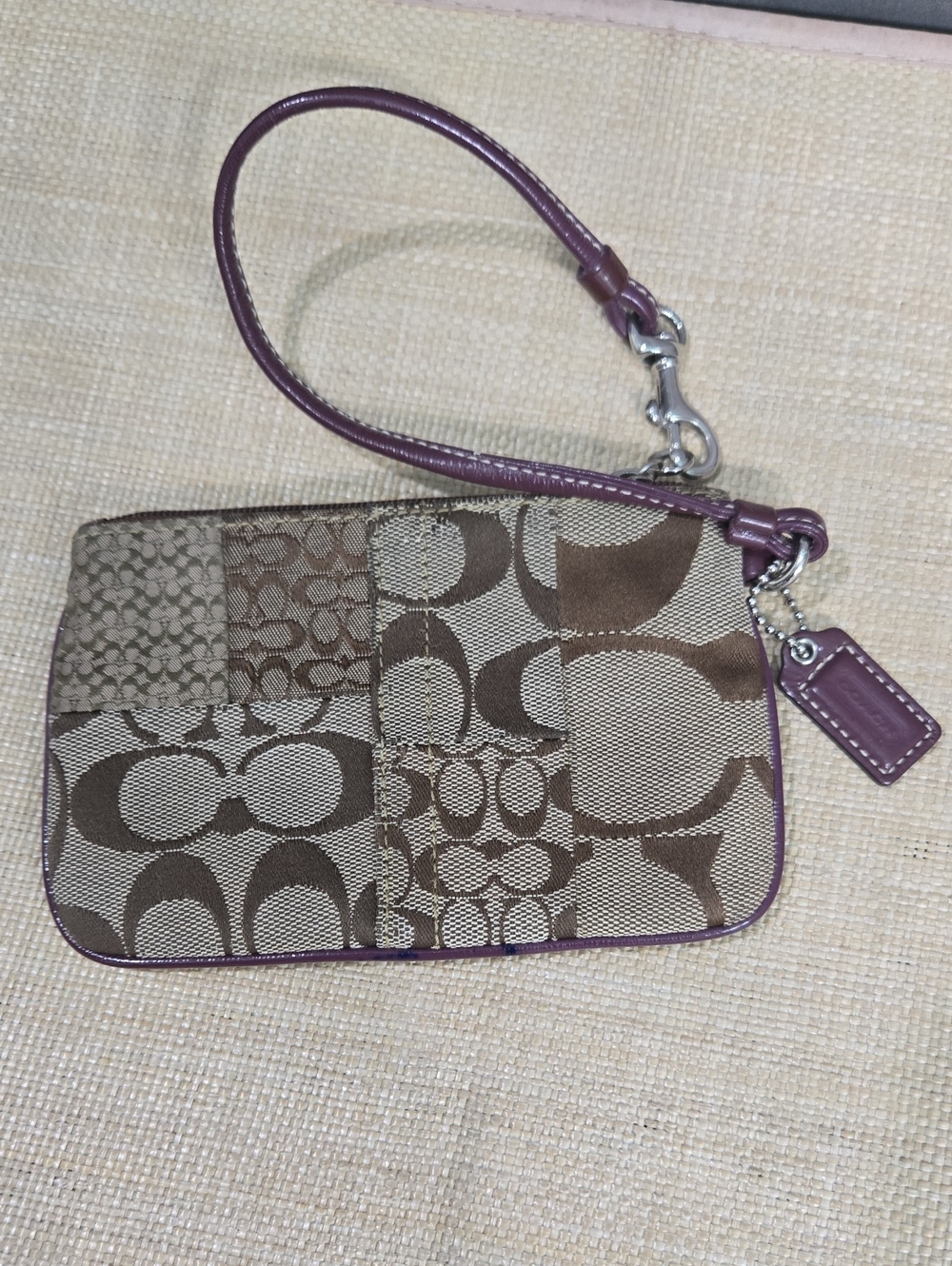 COACH Brown Signature Patchwork Wristlet with Purple Trim